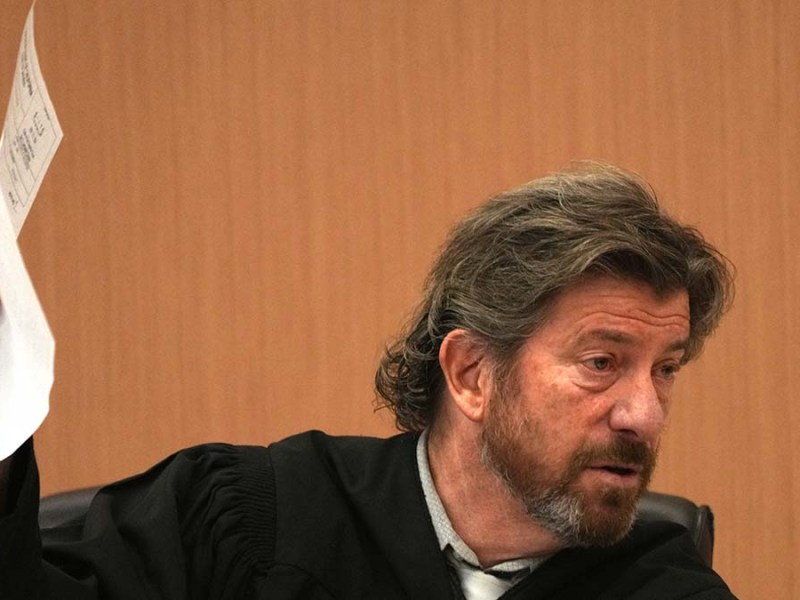 Judge Daniel Goldstein, holding verdict forms, addresses the jury in Jan. 9, 2021, case.